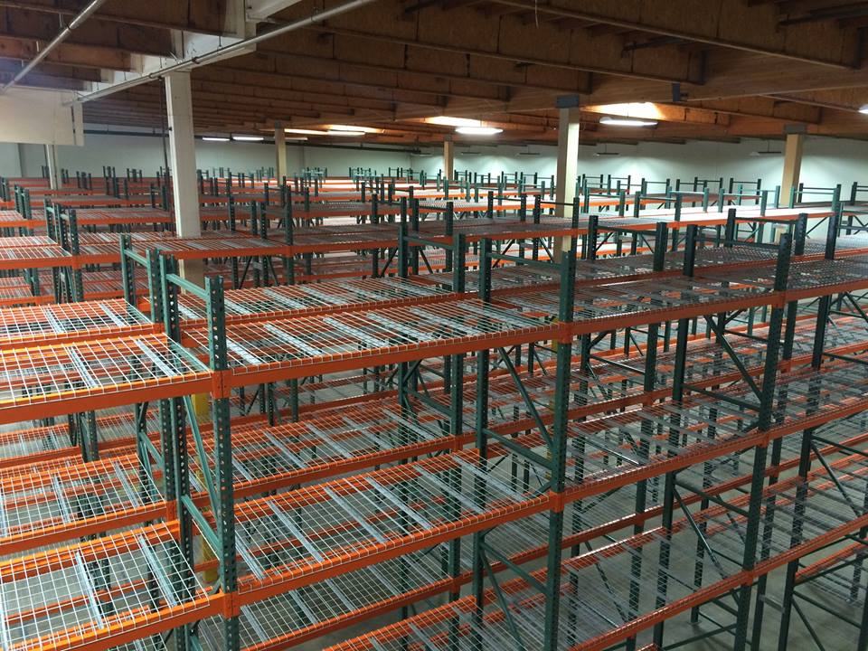 Rows of selective pallet racks loaded with pallets